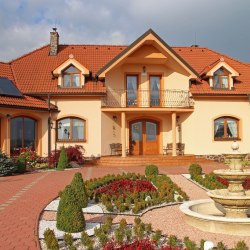 Exterior handrails and wrought iron flower stands in the family villa