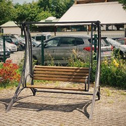 A wrought iron swing combined with wood